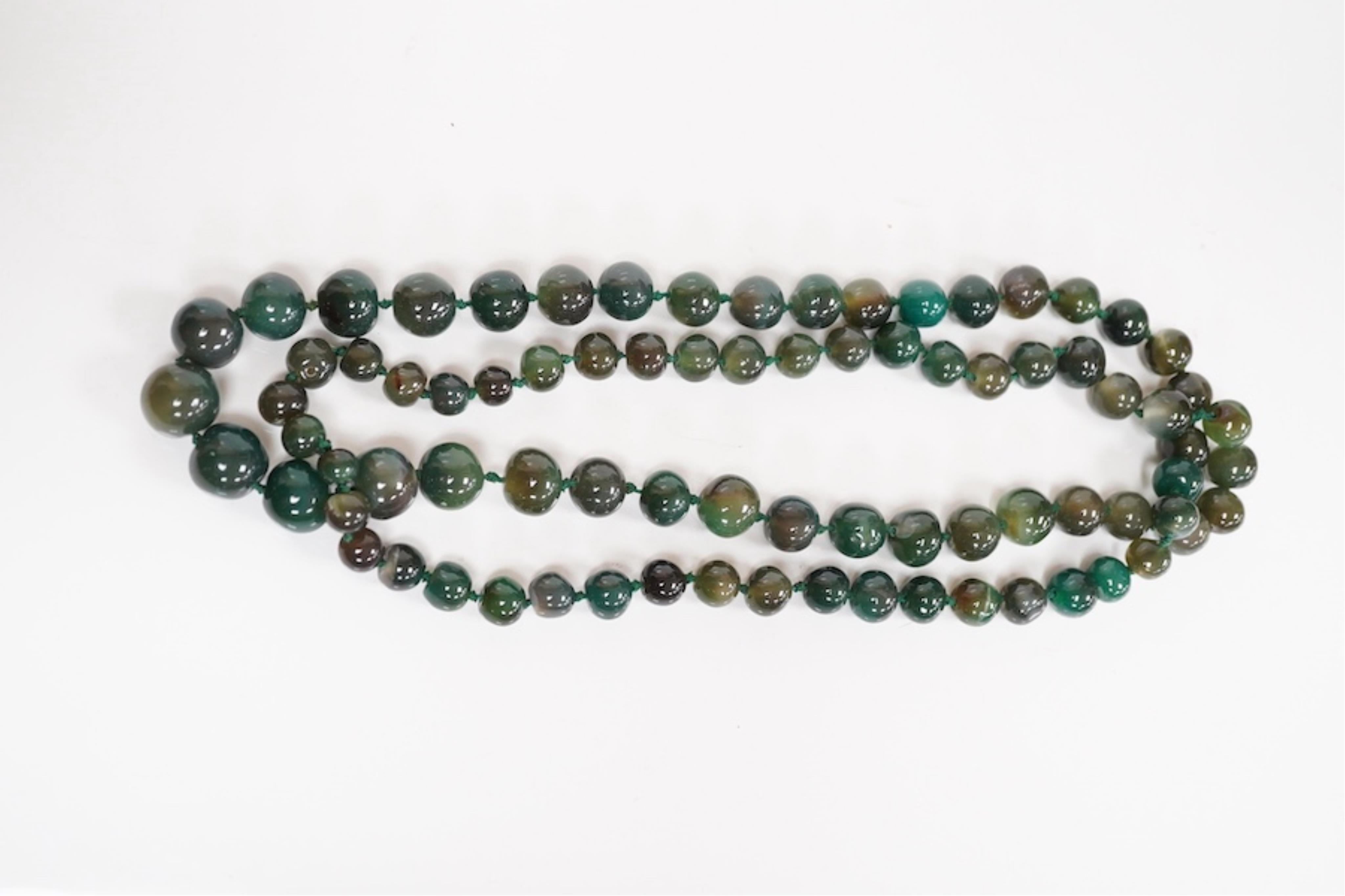 An early 20th century hardstone beaded necklace. Condition - fair